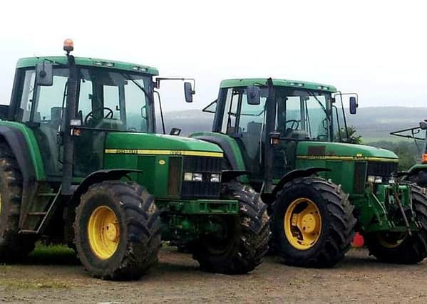 Two John Deere tractors, a 6810 model on left and a 6900 model on right. They were stolen from Woodside Road farm in Ballymena, probably in the early hours of Monday July 31.