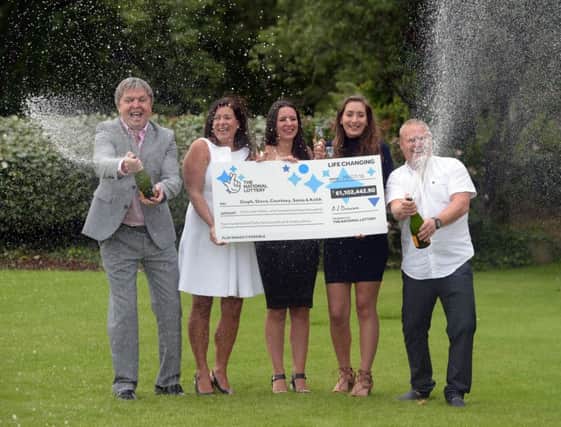 Members of the Davies family who scooped a Â£61.1 million EuroMillions jackpot celebrate their win at the Celtic Manor Resort in Newport, south-east Wales. PRESS ASSOCIATION Photo. Picture date: Wednesday August 3, 2016. See PA story LOTTERY EuroMillions. Photo credit should read: Ben Birchall/PA Wire