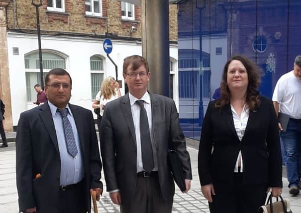 Jonathan Ganesh, Willie Frazer and Susanne Dodd outside New Scotland Yard before the meeting