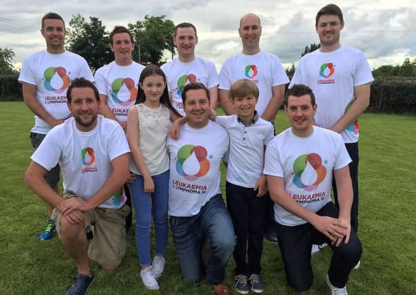 Barry Williamson with his two children Mya and Rhys and some of those who will join him on his mountain challenge