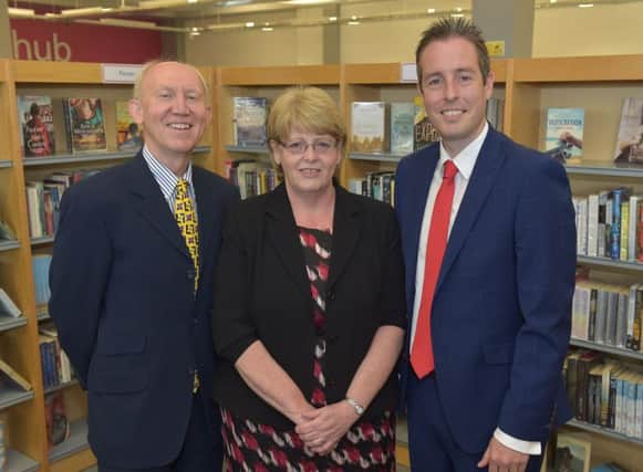 Communities Minister Paul Givan (right) with Libraries NI chairperson Professor Bernard Cullen and chief executive Irene Knox at Lisburn City Library