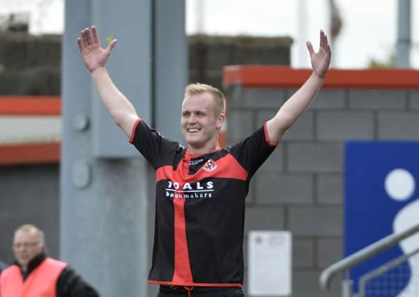 Crusaders Jordan Owens celebrates scoring against Ballymena United