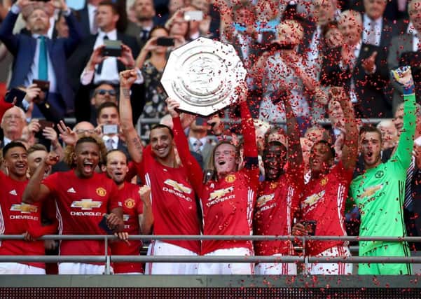 Manchester United's Wayne Rooney lifts the Community Shield