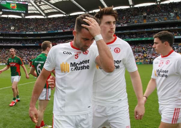 Tyrone's Tiernan McCann and Conall McCann dejected after the loss to Mayo