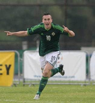 Aaron McEneff celebrating while playing for Northern Ireland's Under-19 team.