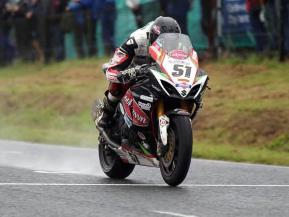 Derek Sheils on the Cookstown B.E. Racing Suzuki during practice for the Dundrod 150 meeting.