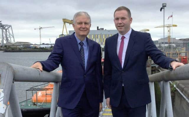 Infrastructure Minister Chris Hazzard pictured in Belfast Harbour with chairman David Dobbin
