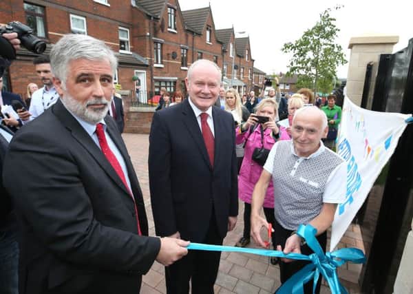 Residents at a North Belfast interface at the celebration event to mark a new era after the removal of a peace wall by the Housing Executive.
 
Deputy First Minister, Martin McGuinness, along with Housing Executive Chief Executive, Clark Bailie and resident Paddy Copeland.

  Picture Matt Mackey / Press Eye