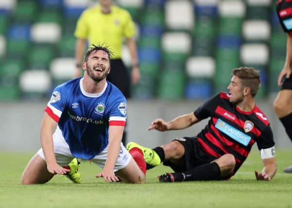 Linfield scrambled to a contentious draw against Coleraine on Wednesday night