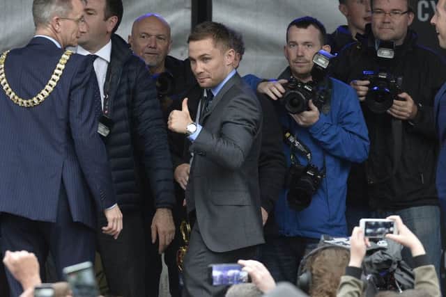Carl Frampton gives a thumbs up to the crowd as he arrives on stage