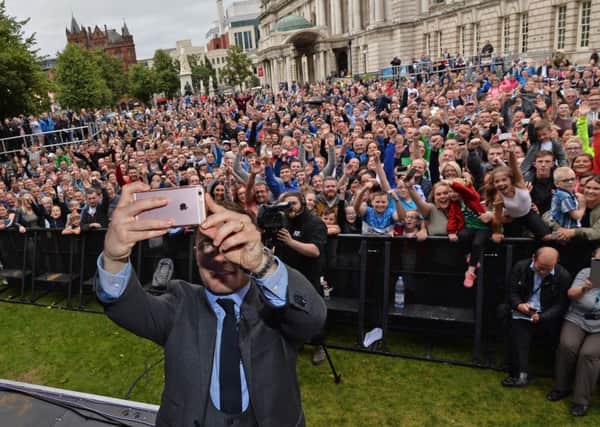 Carl Frampton takes a selfie  during a homecoming at Belfast City Hall to mark his WBA featherweight title win