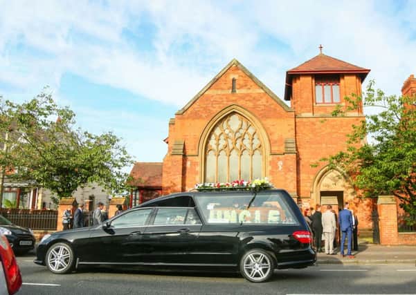 The funeral of John Boreland taking place on the Oldpark Road