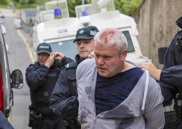 Cllr Padraig McShane is arrested by PSNI during the Twelfth demonstration in Ballycastle after an altercation with Dervock Band. Picture Joe Gilmartin/McAuley Multimedia Ltd