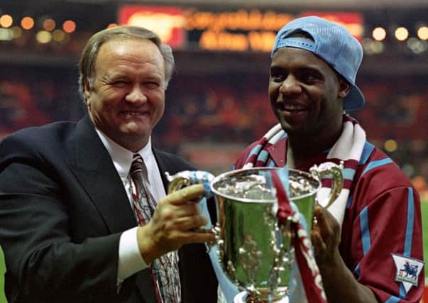 Aston Villa manager Ron Atkinson holding the Coca-Cola cup in 1994 with former Aston Villa footballer Dalian Atkinson (right), who died after being Tasered by police in Telford