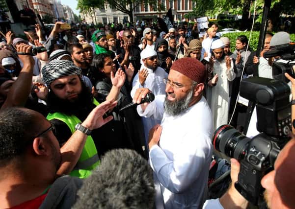 Anjem Choudary (centre) who is facing jail after he was convicted at the Old Bailey of drumming up support for the Islamic State terror group, seen addressing a crowd in 2011. Photo: Gareth Fuller/PA Wire