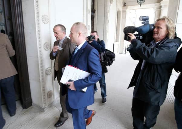Jamie Bryson, with Pastor Mark Gordon, arriving at Stormont to appear before its Nama inquiry last year. By Matt Mackey, Presseye