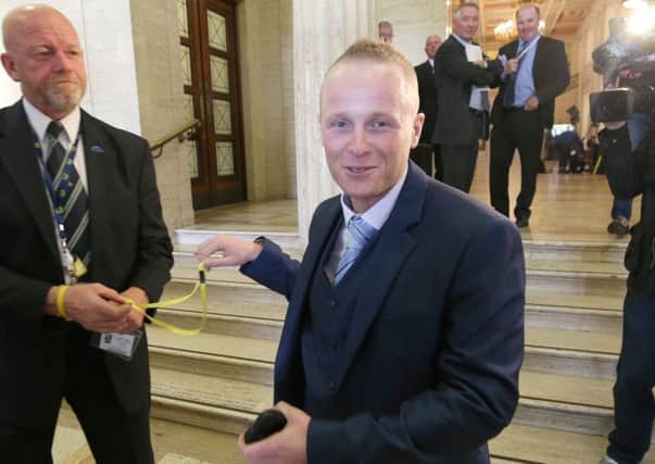 Jamie Bryson hands back his pass after giving evidence to Stormonts finance committee last year