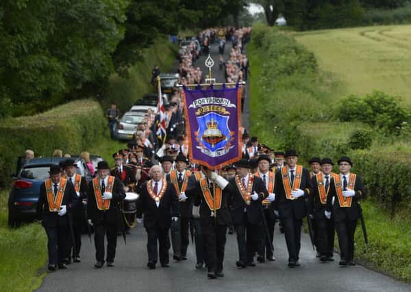 Pacemaker press 10/08/2016. Orange men make the annual march to Drumcree road. The Portadown Church was the scene of serious rioting every year in the late 1990s when Orange men were barred from walking along the Garvaghy Road to return to the parade's starting point at Carleton Street. Picture Mark Marlow/pacemaker press