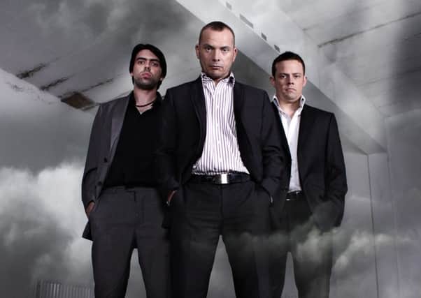 Paranormal investigator Darren Ansell (centre) with colleagues Cormac Donnelly (left) and Tony Armstrong (right)