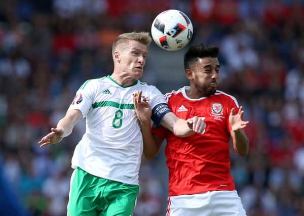 Northern Ireland skipper Steven Davis and Wales' Neil Taylor
 during Euro 2016