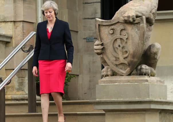 Theresa May on her first visit to Stormont as prime minister. 

Photo by Kelvin Boyes / Press Eye