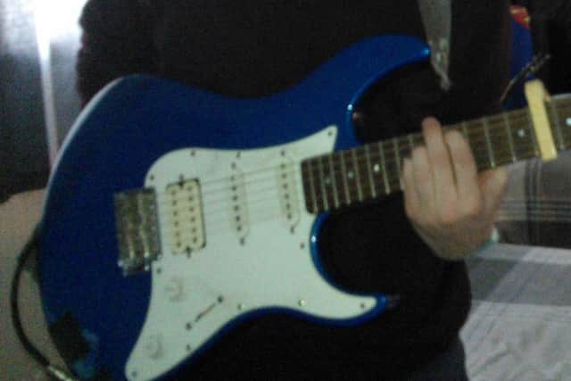 The guitar that was stolen.