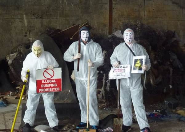 Anonymous activists pictured in the Waterside area of Londonderry