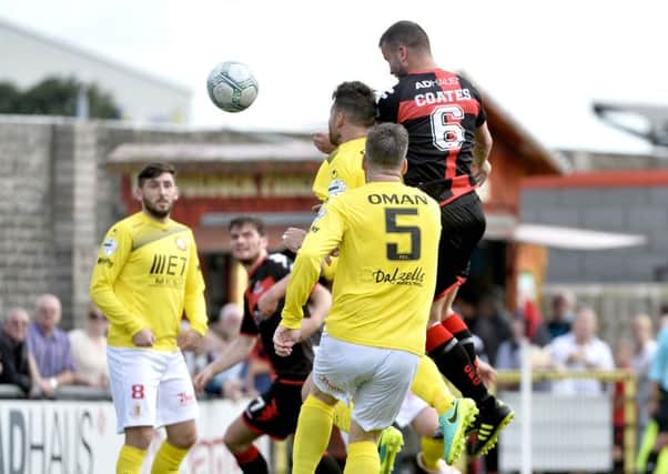 Colin Coates heads home the winning goal for Crusaders against Portadown. Pic by PressEye Ltd.