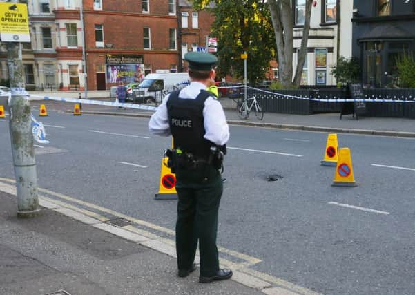 Policeat the scene on the Malone Road in Belfast between Eglantine Avenue and Wellington Park, where subsidence led to the closure of the road