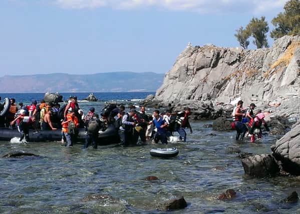 A migrant boat from Turkey arrives on the Greek island of Lesbos. September 8 2015 By Ben Lowry