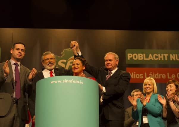 Sinn Fein leader Gerry Adams surrounded by applauding party members at the Sinn Fein Ard Fheis in 2013. Sinn Fein is renowned for its tightly-disciplined party, with breaches of unity rarely displayed publicly.