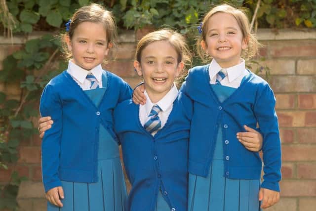Rosie (left) and Ruby Formosa, from London, with their elder sister Lily (centre)