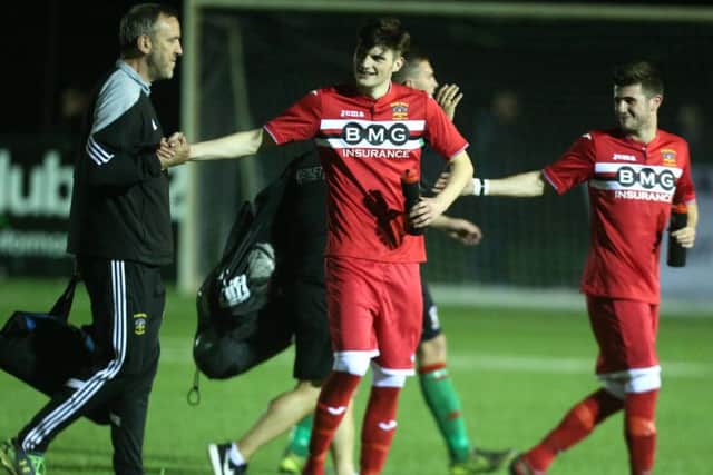 Annagh United's Jordan Campbell (centre) - one of the scorers against Glentoran - during the post-match celebrations. Pic by PressEye Ltd.