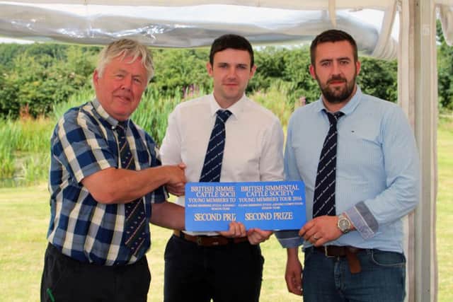 British Simmental Cattle Society presdient David Donnelly congratulates Northern Ireland senior team members Andrew Clarke, Tynan, and Chris Boyd, Portglenone.