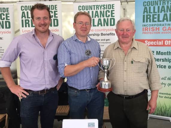 Adam, Barry and Tom with the John McClelland Memorial Perpetual Trophy on the CAI stand