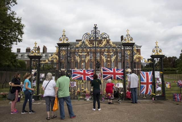 Tributes are left outside Kensington Palace, London, on the anniversary of the death of Diana, Princess of Wales, who was killed in a car crash in central Paris along with Dodi Fayed