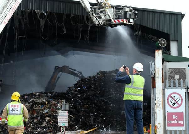 Firefighters at the scene of a fire at the Wastebeater recycling plant in west Belfast on Thursday