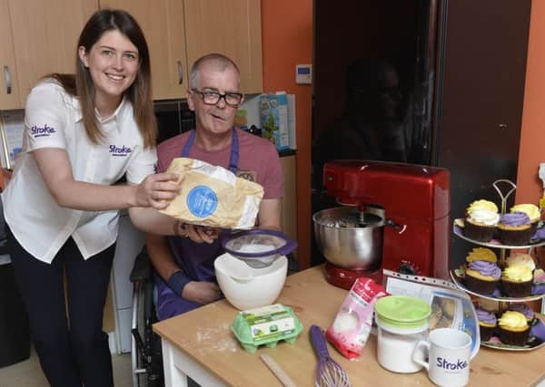 Give a Hand and Bake: Stroke Associations Laura Hewitt with stroke survivor Ian Smyth from Bangor