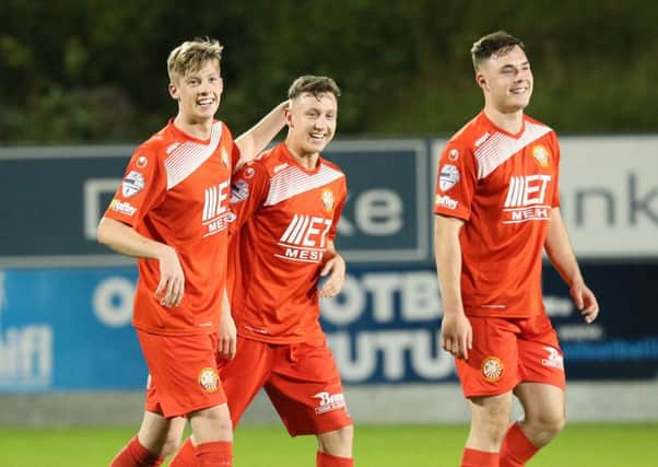 Eoin Kirwan, Mikey Withers and Nathaniel Ferris celebrating Portadown's midweek League Cup win. Pic by Pacemaker.