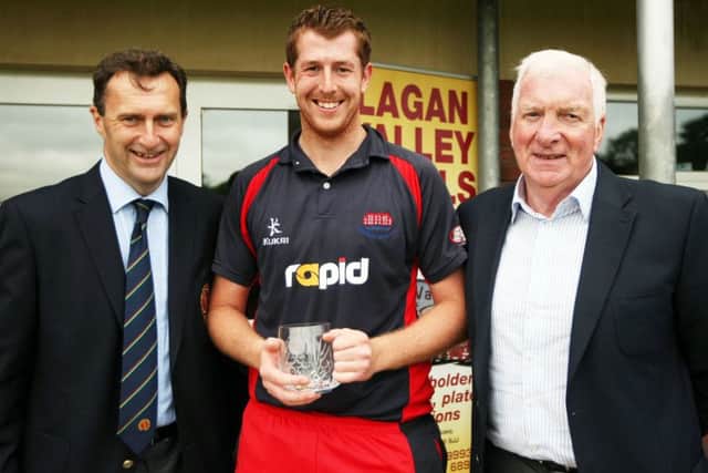 Greg Thompson receives the man of the match award in the Twenty20 Cup final