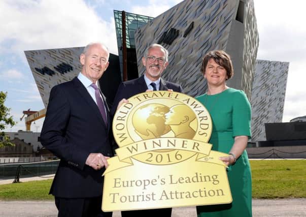 First Minister Arlene Foster joins celebrations with Titanic Belfasts vice-chairman Conal Harvey and chief executive Tim Husbands MBE
