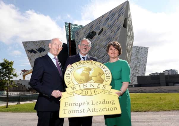 First Minister Arlene Foster joins celebrations with Titanic Belfasts Vice-Chairman Conal Harvey, Chief Executive Tim Husbands MBE and Titanic Foundation Limited's Kerrie Sweeney, as it is named as Europes Leading Visitor Attraction at the prestigious World Travel Awards. INNL 36-650-CON