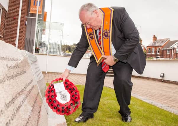 Assistant Grand Master Rev Mervyn Gibson lays a wreath in remembrance of those servicemen who lost their lives at Guillemont and Ginchy during the Battle of the Somme 100 years ago this month Pic: Graham Curry