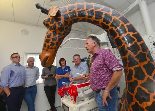 Sir Ian Botham officially opens the specialist Giraffe Omnibed  at the Royal Belfast Hospital for Sick Children