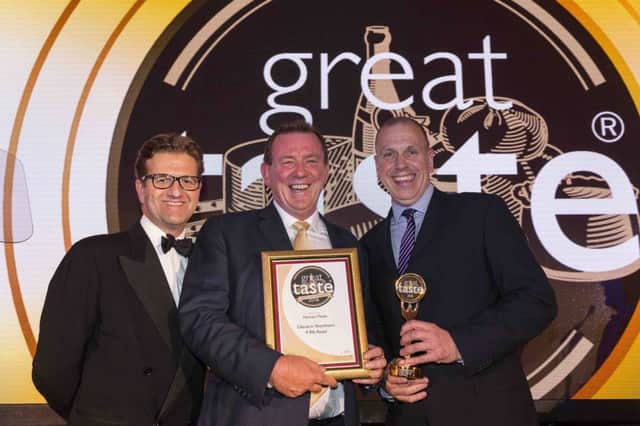 Peter Hannan, centre, and John Hood of Invest NI, right, pictured with the award in London with John Farrand of the Guild of Fine Food