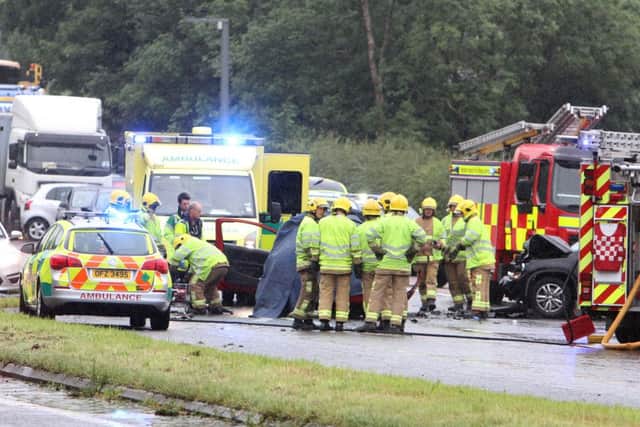 The emergency services at the scene of the crash on the A1 last August