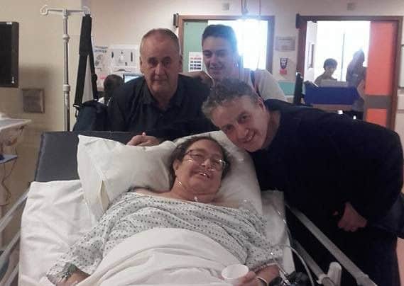 Raymond and Briege in hospital with Briege's supportive husband and daughter