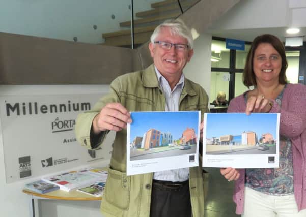 Portadown 2000 manager Esther Baird and sub-committee chairman Bryan McLaughlin show artists impressions of the project.