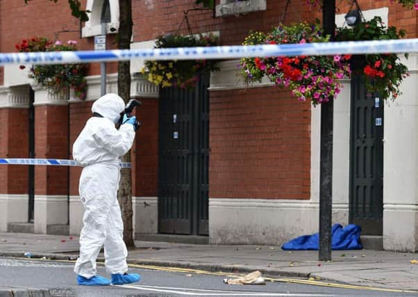 Investigators at the scene in Belfast