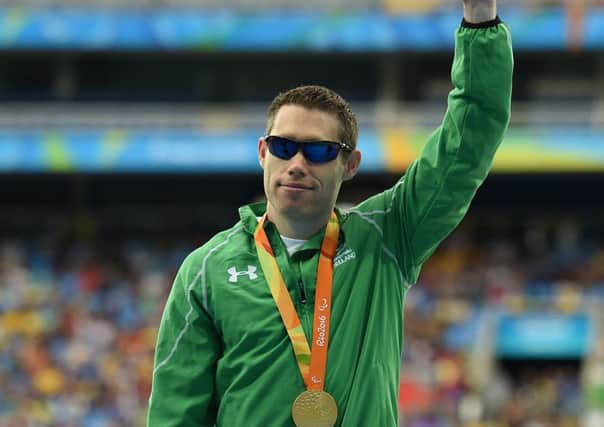 Jason Smyth of Ireland with his gold medal after winning the men's 100m T13 final in Rio